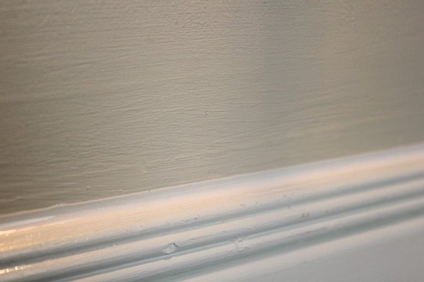 caulk before or after painting walls