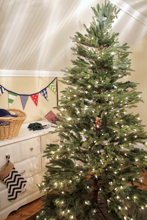 A boyish Christmas tree! Perfect for a little boy's room or a nursery! Love the baseball hat at the top.
