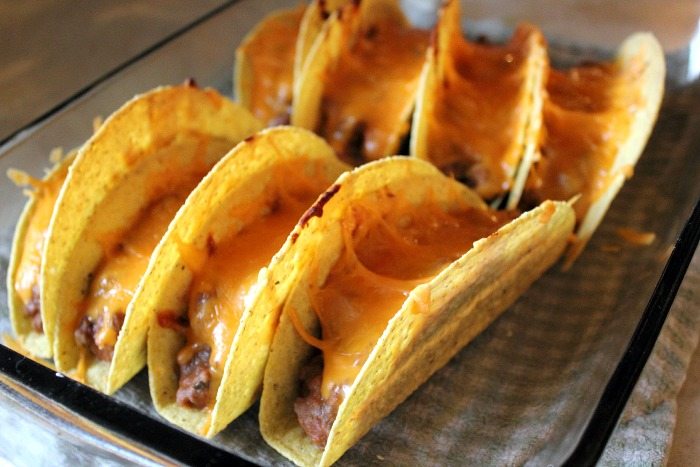 Making tacos in your oven is a great way to help your toppings all stick together and the end result is extra delicious! A crowd pleasing recipe for sure!