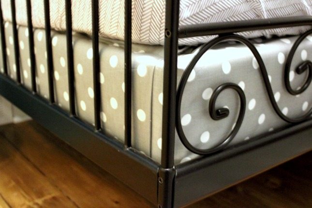 Why do they make box springs to look like that? All shiny and with those patterns that say "Look at me! I'm an exposed box spring!". Well, if you've got a bed that leaves your box spring hanging out for the world to see, then we've got the DIY box spring cover for you!