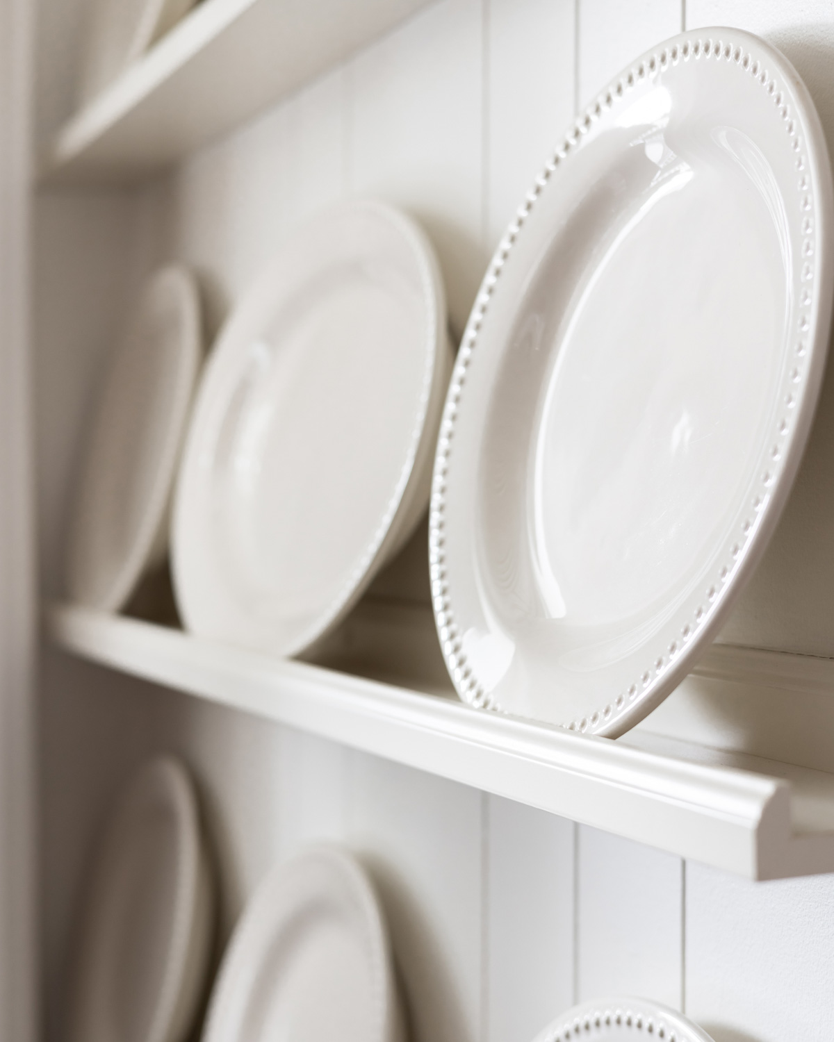 Shallow shelves for displaying plates and platters.