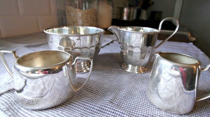 Polished silver serving pieces.