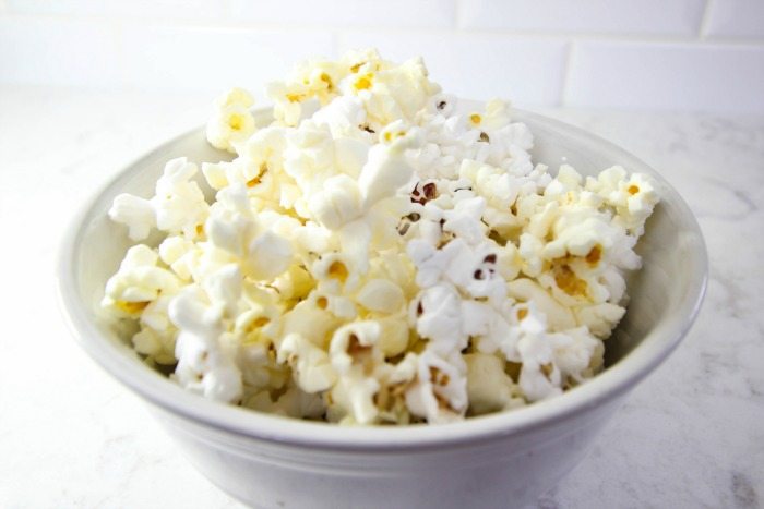 Fun trick for healthier DIY microwave popcorn using a plain paper bag!