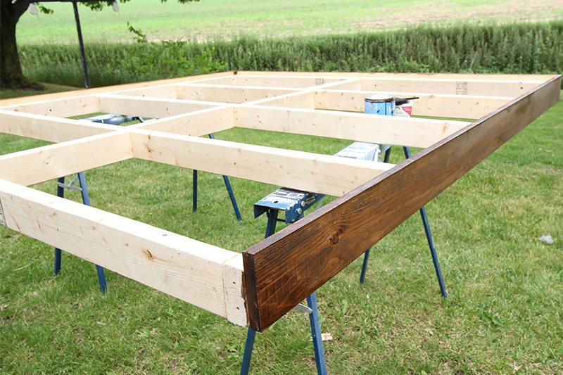 Make your own simple bed frame for your giant bed instead of paying thousands for one from the store!
