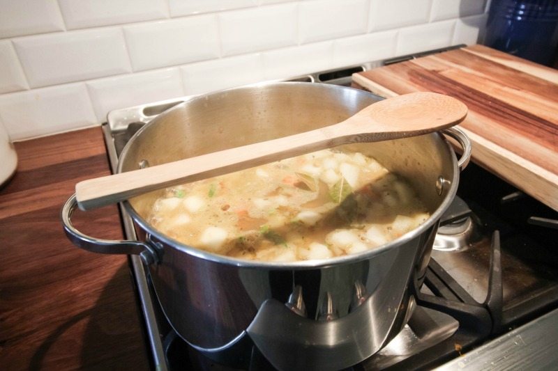 Keep your stove cleaner and make your time in the kitchen less stressful with the wooden spoon on the pot trick! Here's how to stop pots from boiling over.