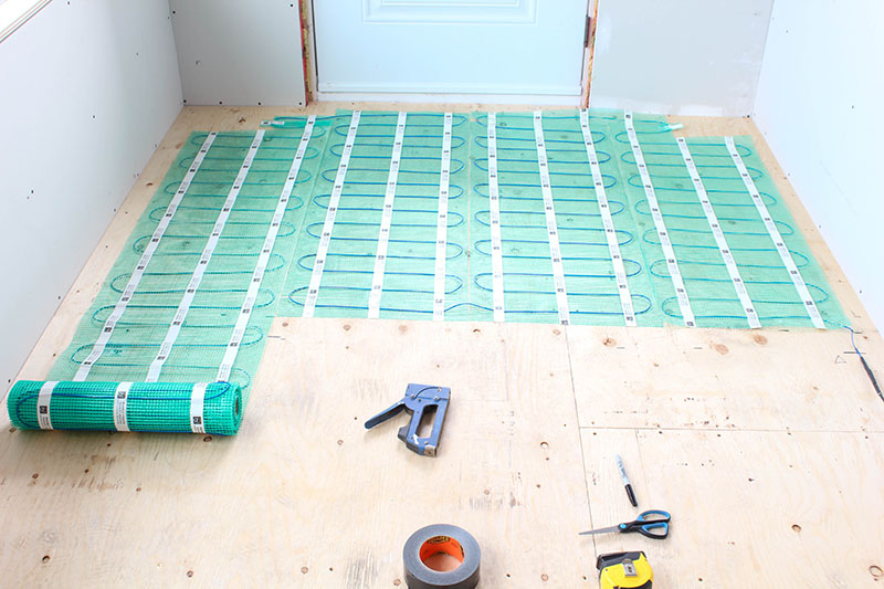 If you dream of having heated floors in your home but worry about what a big, difficult project installing them can be, check out this easy to install heated flooring system! This is definitely the way to go!