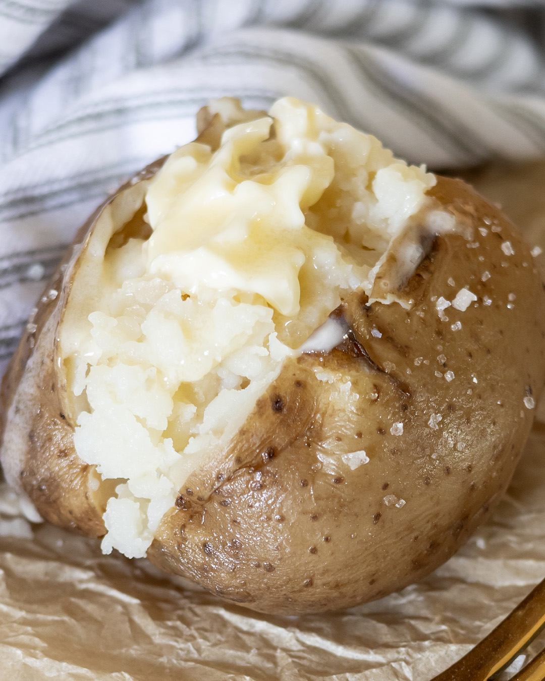 Close up view of crock pot baked potatoes