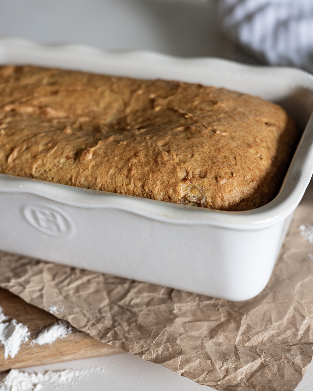 Three ingredient banana bread in an Emile Henry ruffled loaf baker.