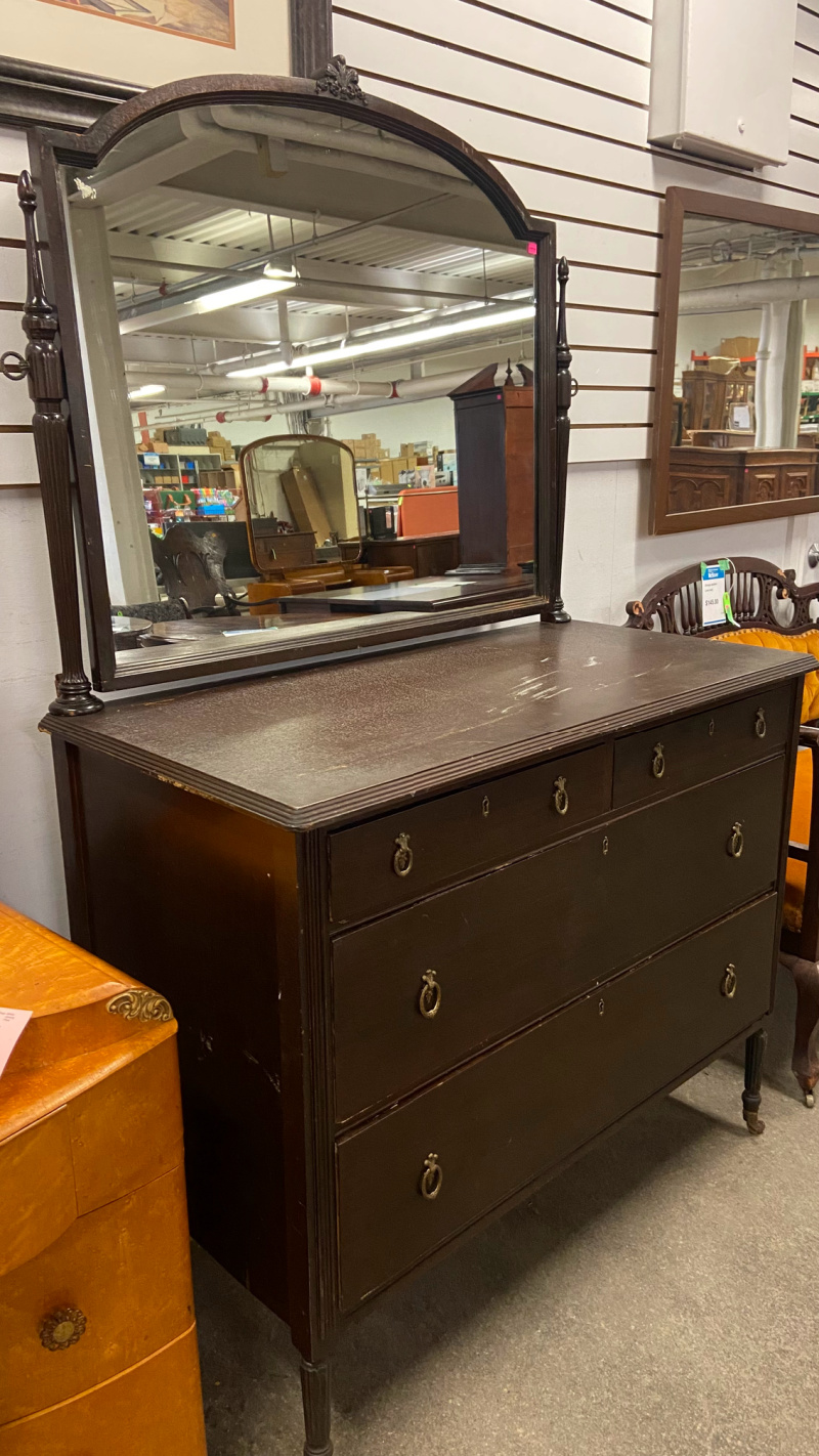 An antique dresser with mirror available for sale.