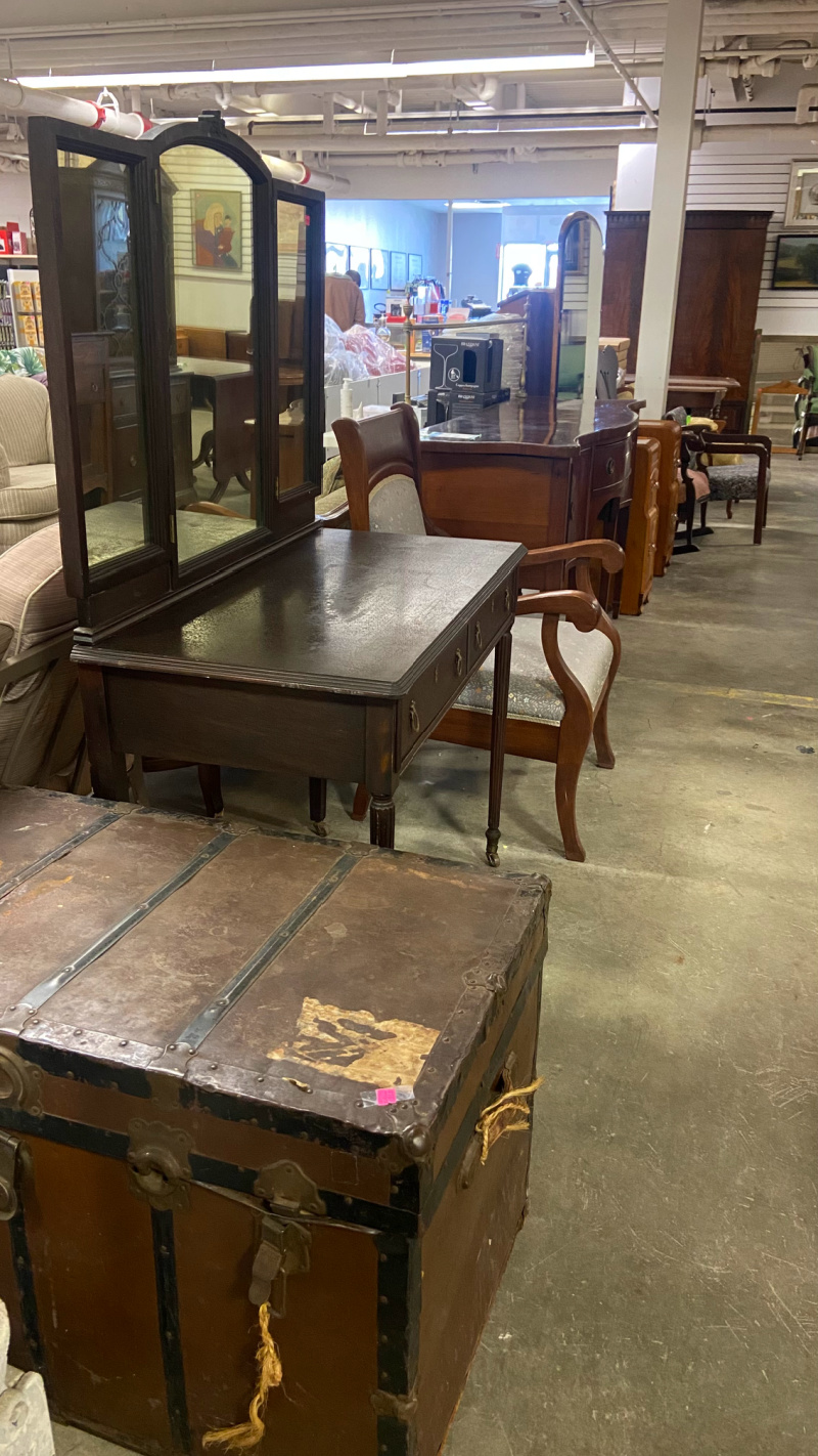 Beautiful antique furniture pieces lined up for sale.