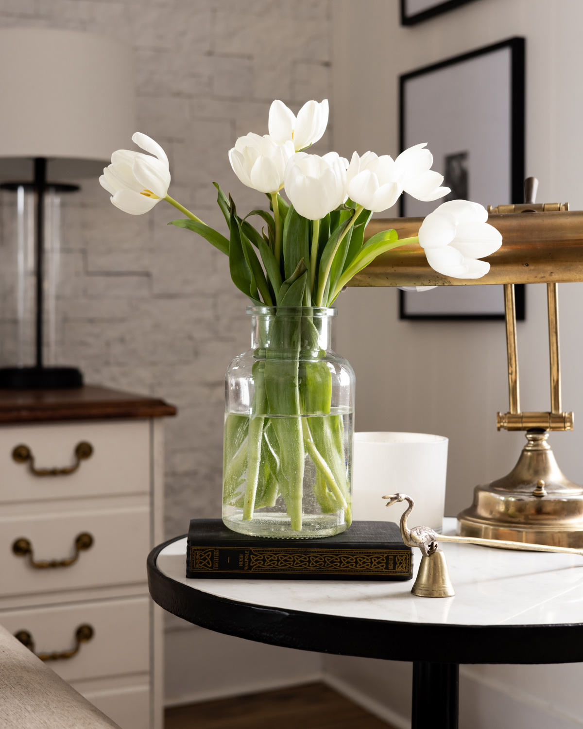 Beautiful white tulips in a glass vase.