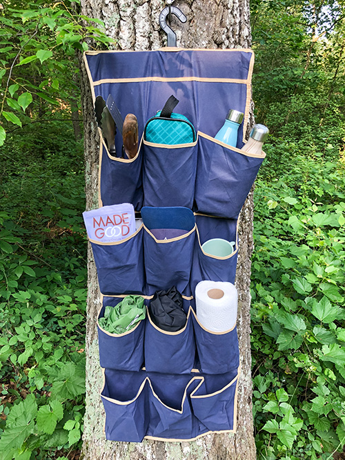 Try this super clever and affordable camping organizer idea on your next family camping trip to keep everything clean and organized!