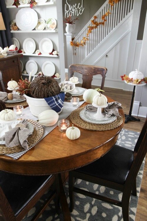 A dining room decorated for fall.