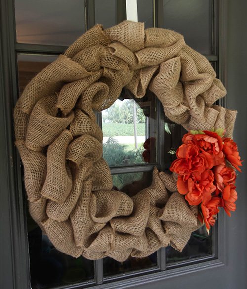 A fall wreath made from burlap ribbon.