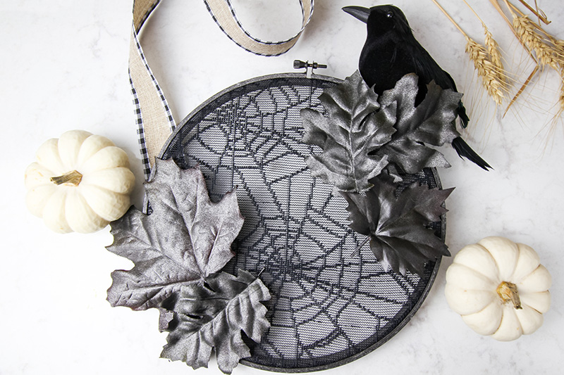 This embroidery hoop halloween wreath will help set a spooky tone for those coming up to your house and can be made with supplies from the dollar store!