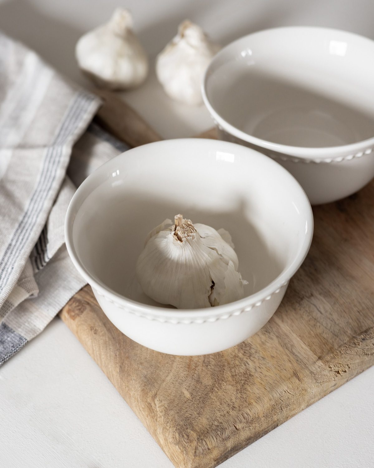 Unpeeled garlic in a bowl.