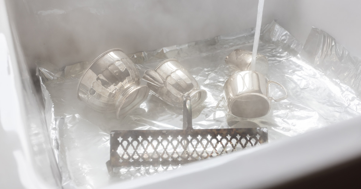 How to clean silver with hot water and baking soda.