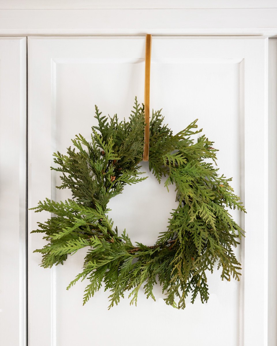 Cedar wreath on a cabinet door.