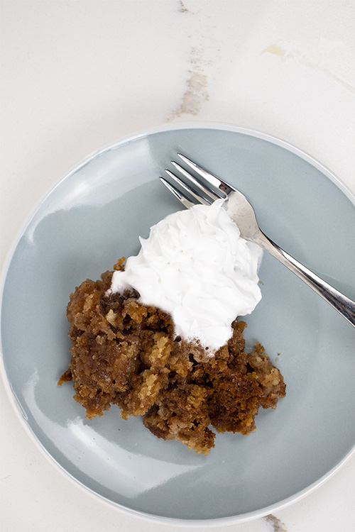 Try this slow cooker apple pie dump cake the next time you want a family-style comfort food dessert that will feed a crowd! So easy to make and dangerously tasty!