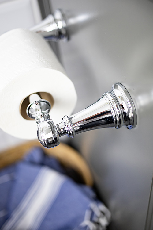 Hairspray can build up on surfaces in the bathroom over time and make them look corroded and dull. Here's how to clean hairspray off of bathroom fixtures!