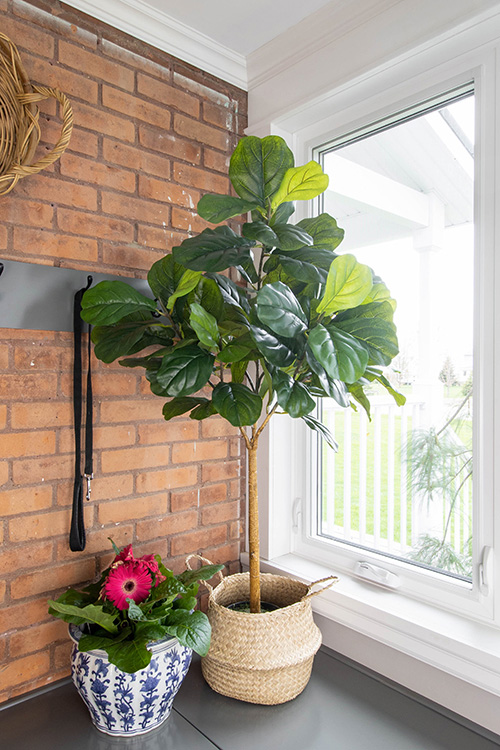 A faux fiddle leaf fig tree can add a good dose of no-maintenance greenery to your home, but they can be a little tricky to get right. Here are my tips!