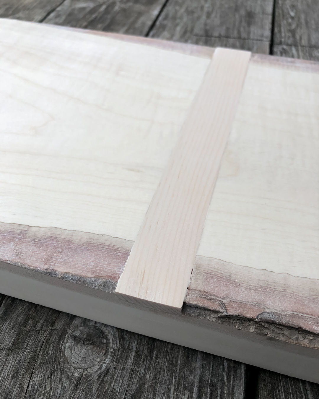 How to make your own DIY giant cutting board to use as kitchen decor. Make it exactly the size you need for much less than you'd pay to buy one!