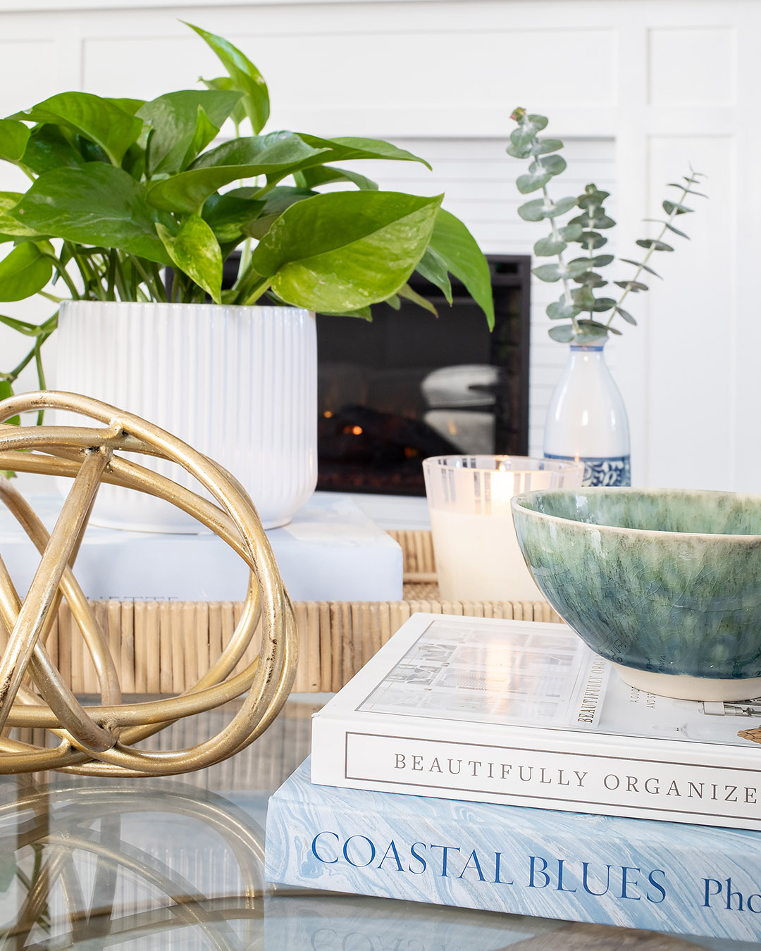 Today I thought I'd share a little peek at what our living room looks like right now and maybe give you a few ideas for styling a small round coffee table.