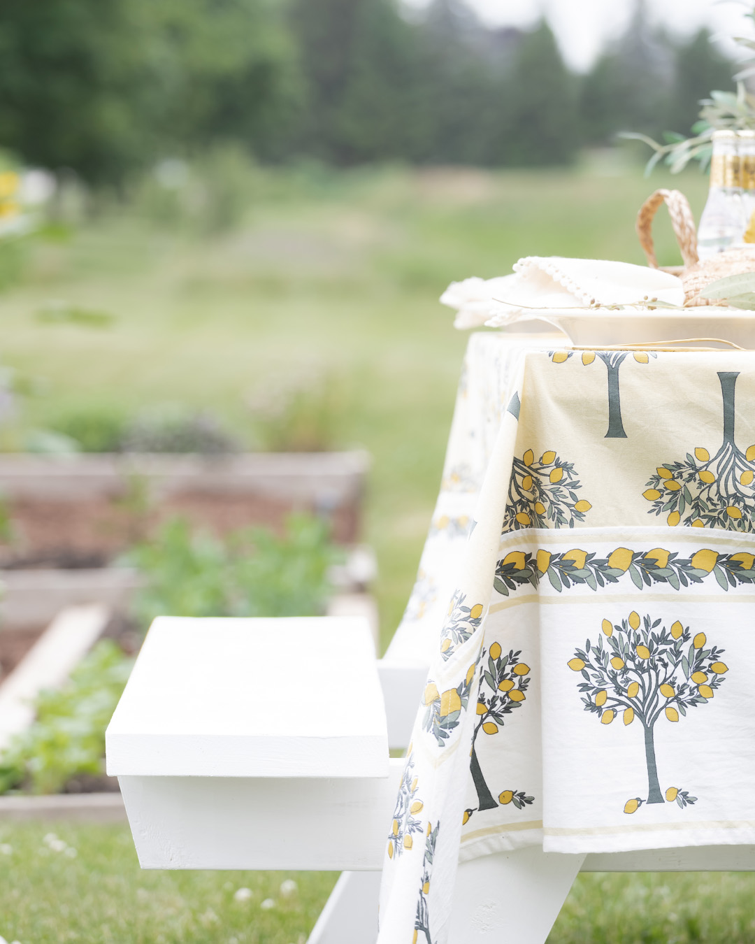 I set up our newly refreshed picnic table the other day in our freshly-tidied garden with the most lovely summer table linen finds from my friends at Kochi Stores. Please enjoy these photos of our picnic in the garden!
