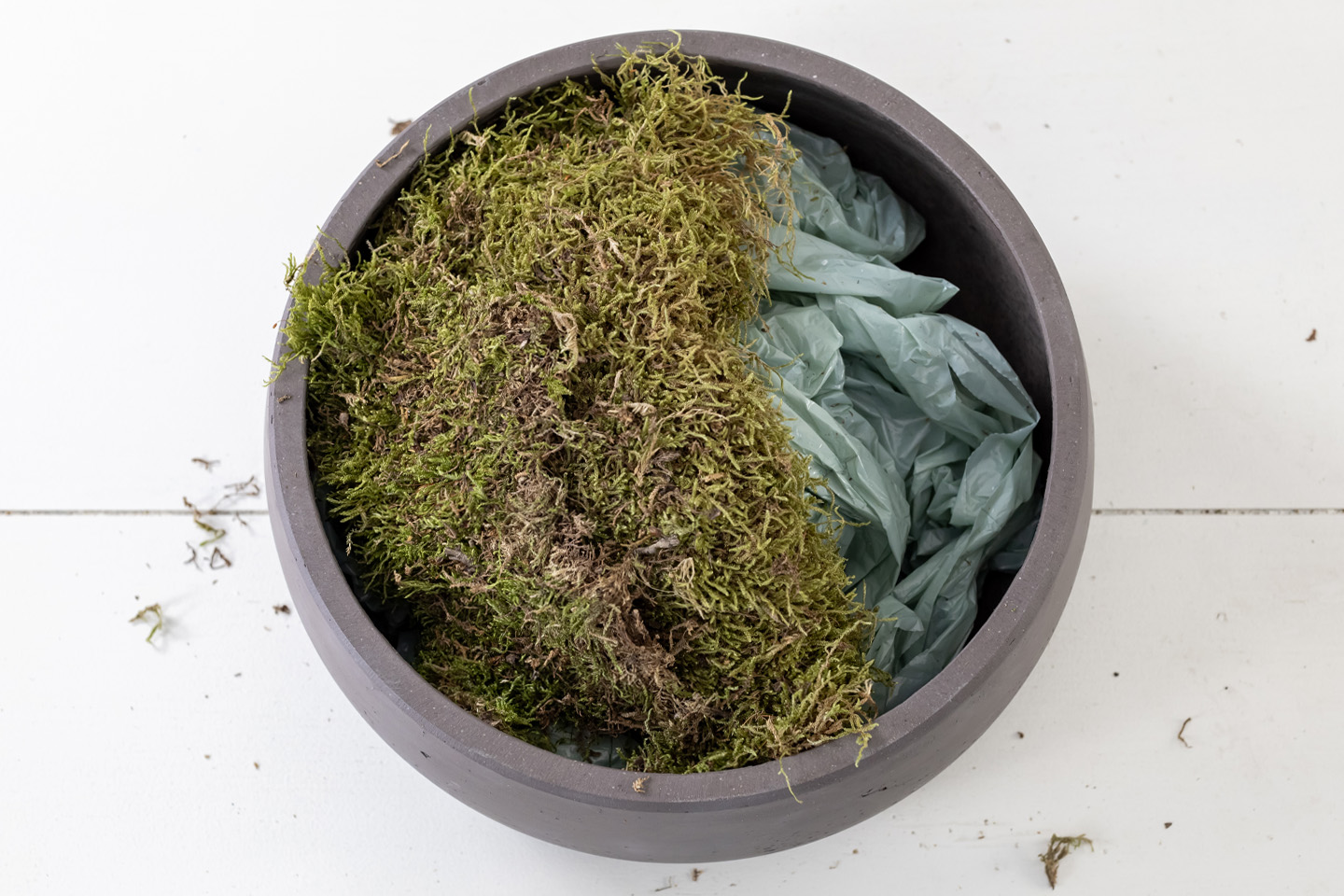 This moss bowl centerpiece makes a great addition to a coffee table, console, or on a shelf! It's easy to make, on-trend, and works well as an alternative to a plant if you have an area with low-light.