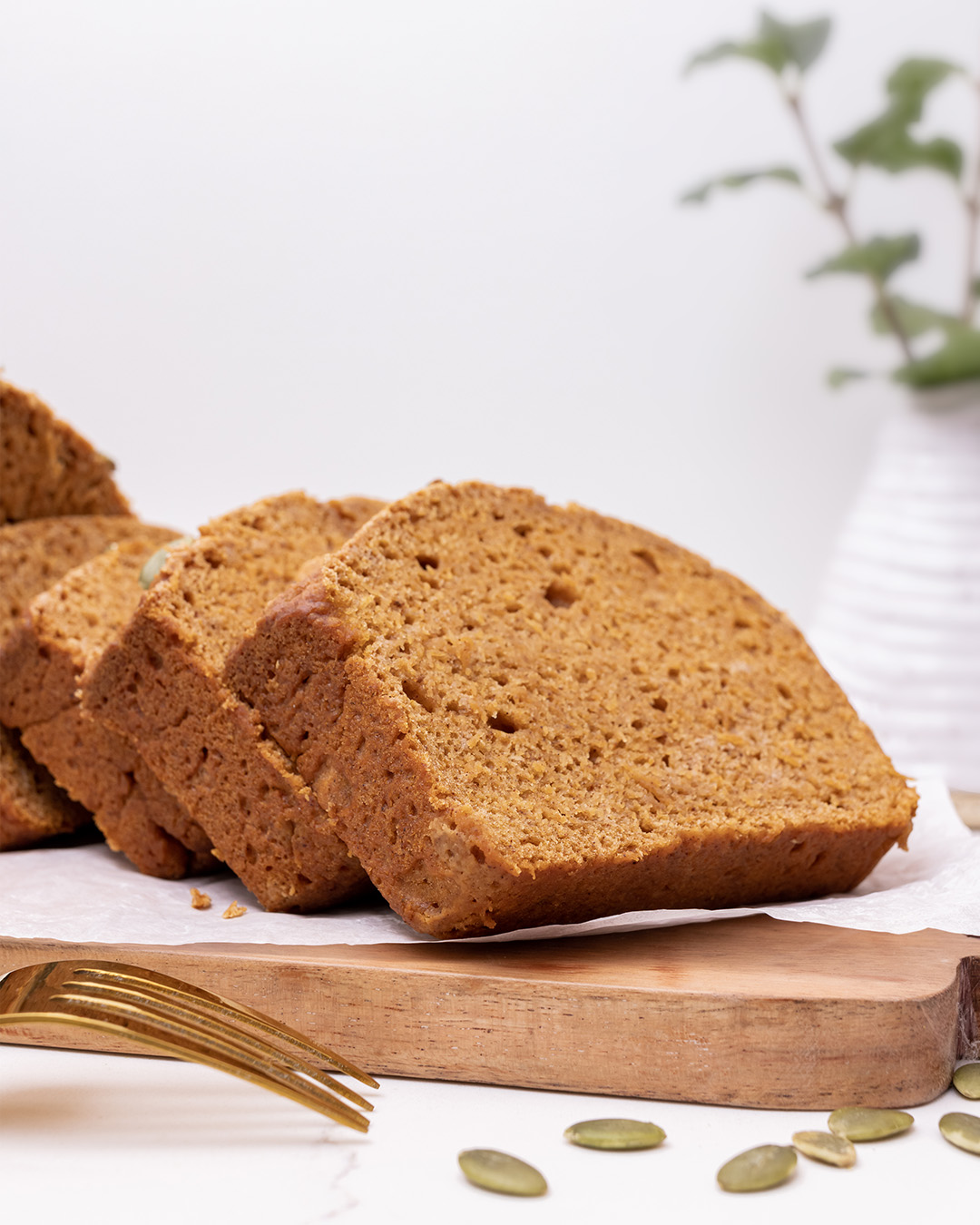 Close up view showing texture of sliced pumpkin bread.
