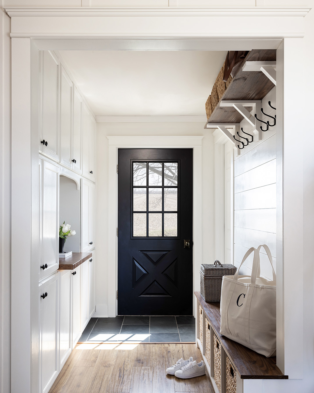 Sharing another one of our home's mudrooms and entryways today! This one is located in the back of our house and is used as kind of a "Mom's mudroom". Here's a look at our current back hall mudroom!
