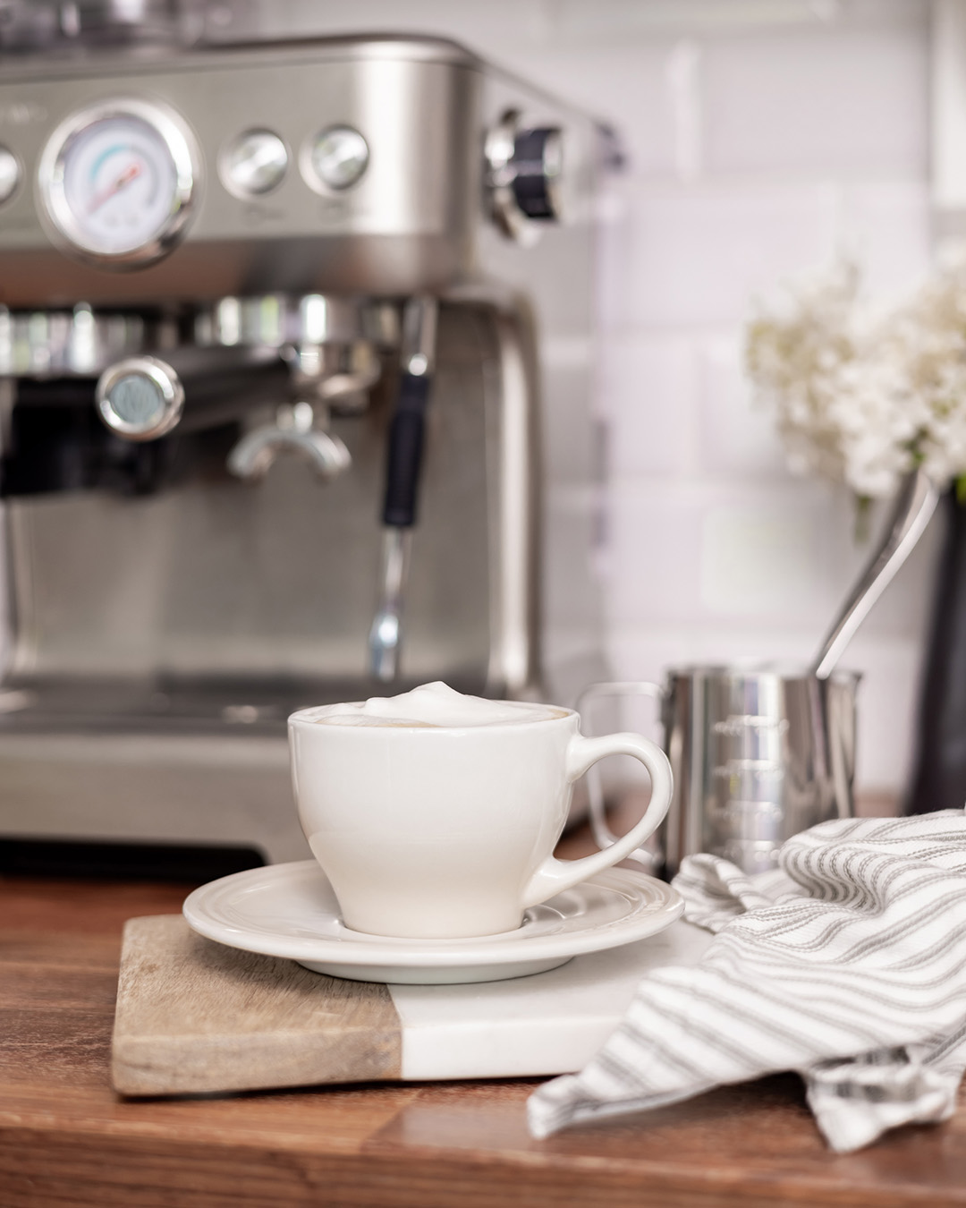 A home espresso machine with a perfectly-made cappuccino.