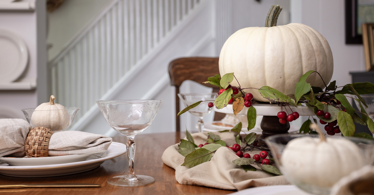 Scrunched napkins add softness to the centrepiece for your Thanksgiving table.