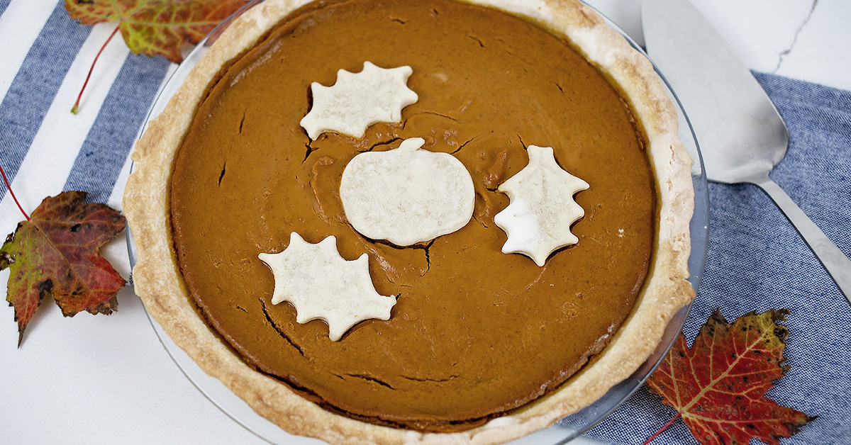 A pumpkin pie decorated with leftover pie crust