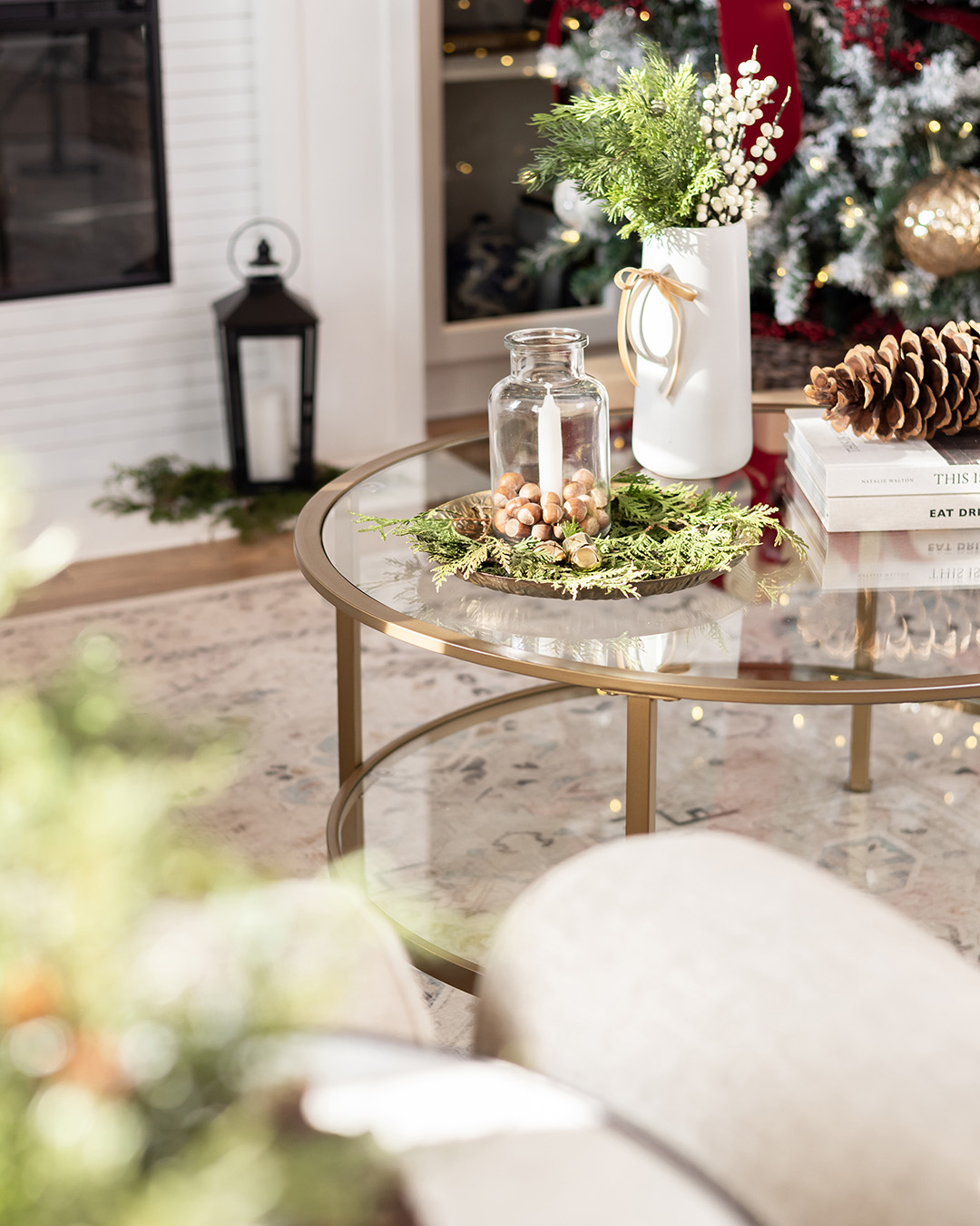 A peaceful Christmas coffee table with greenery and pinecones.