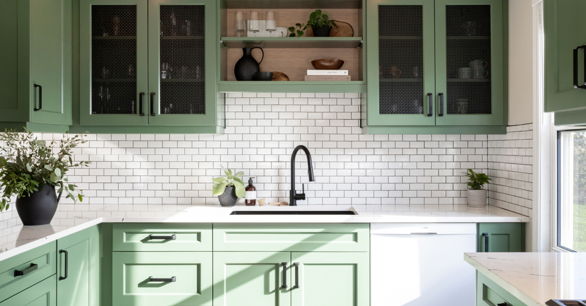 This cheerful kitchen features bright green cabinets on uppers and lowers.