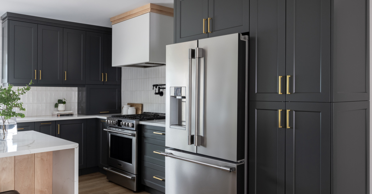 Elegant dark green cabinets paired with gold hardware.