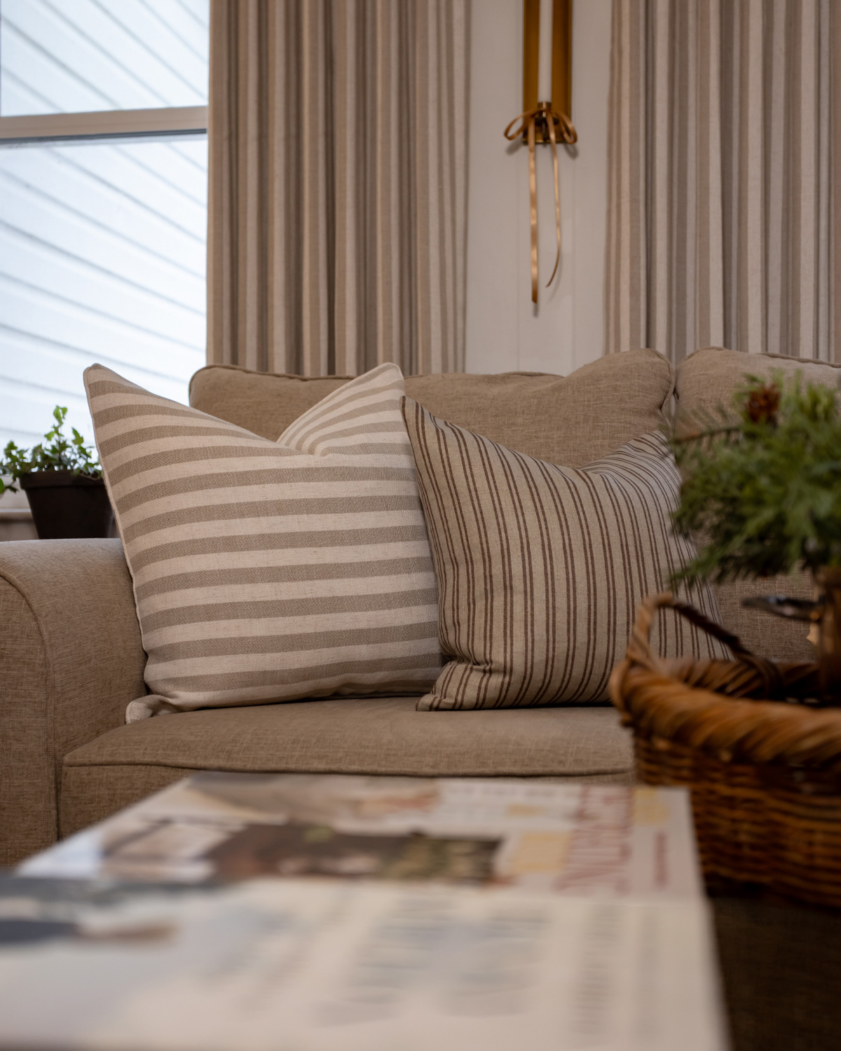 Striped pillows add softness and a touch of pattern.