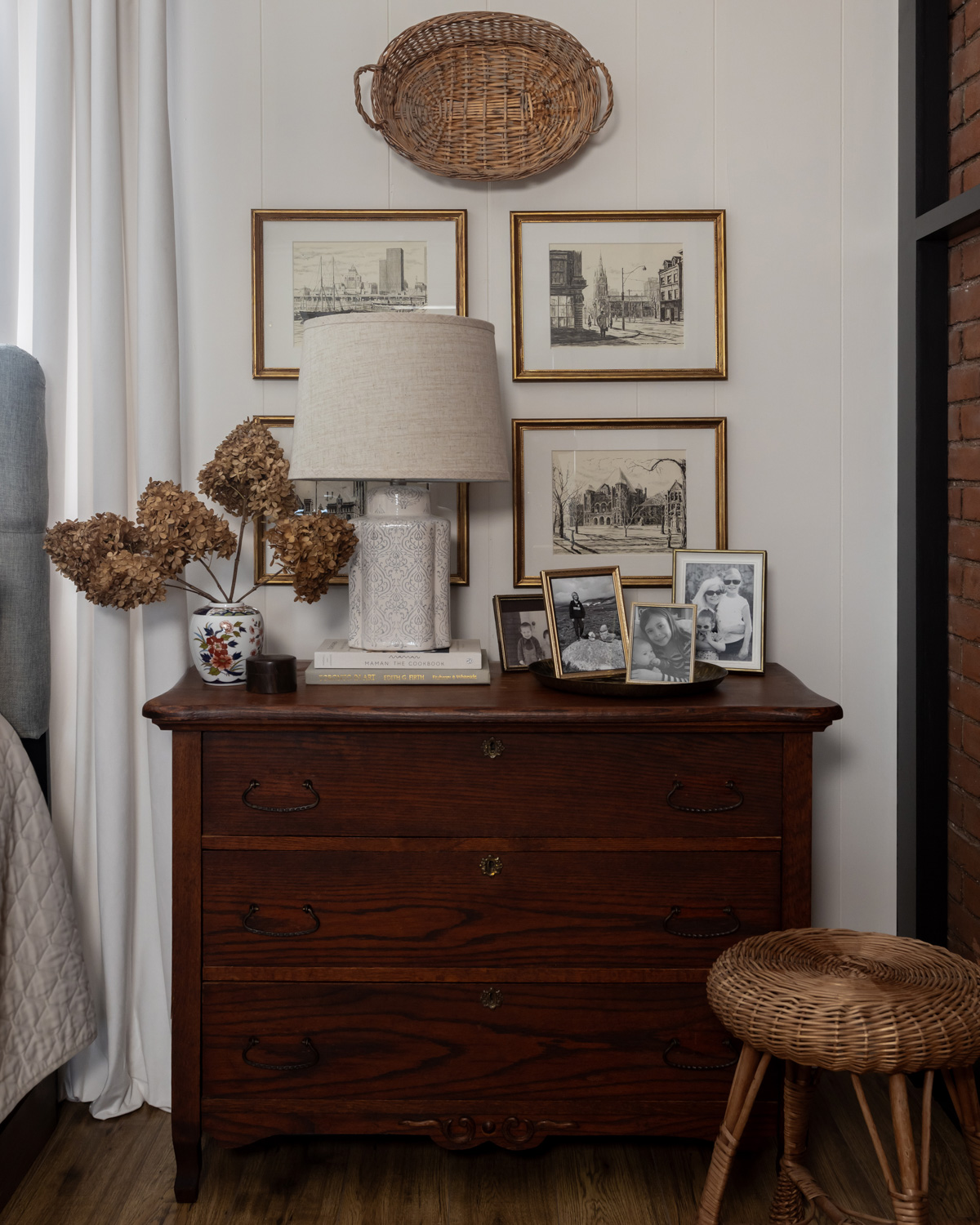 A jar-style lamp on a bedside table