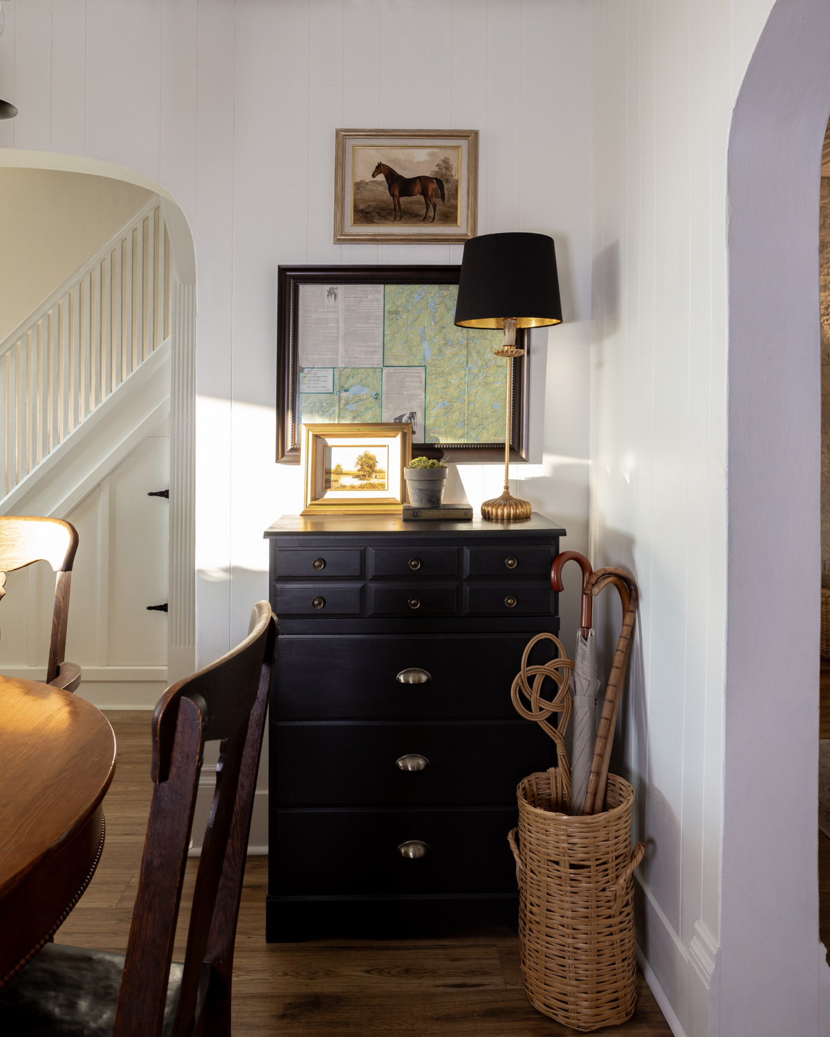 A tall buffet lamp in the dining room.