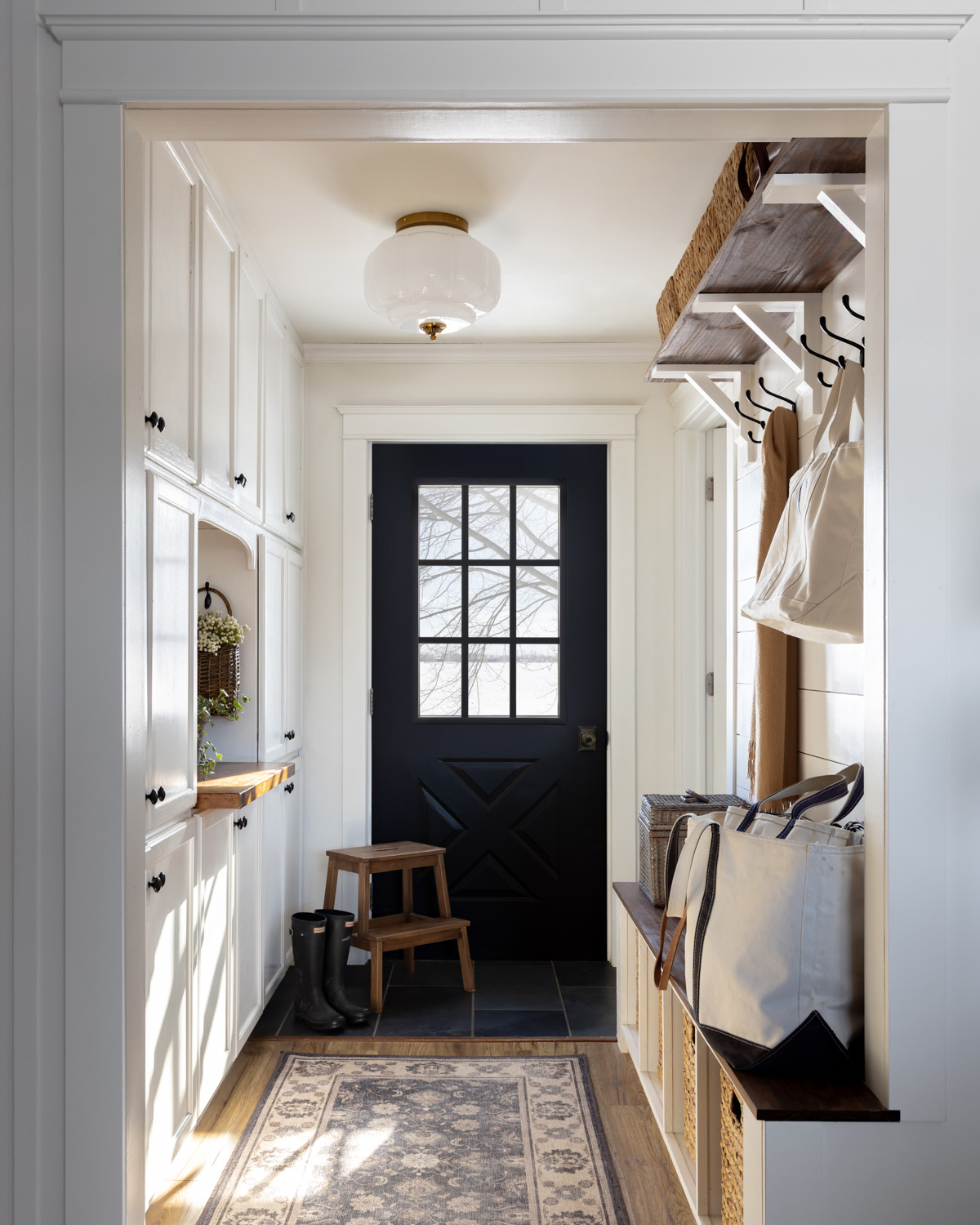 Boot root painted in warm white with a milk glass light fixture.