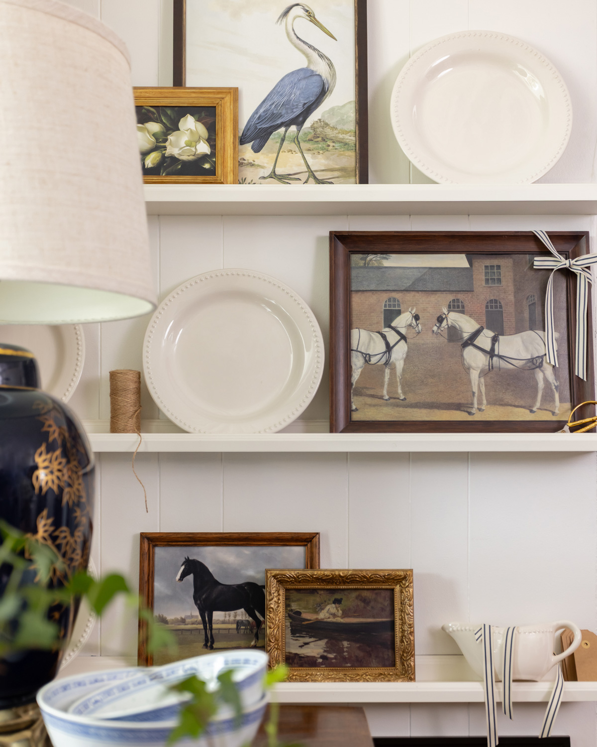 Vintage-style prints featuring nature and equestrian scenes.