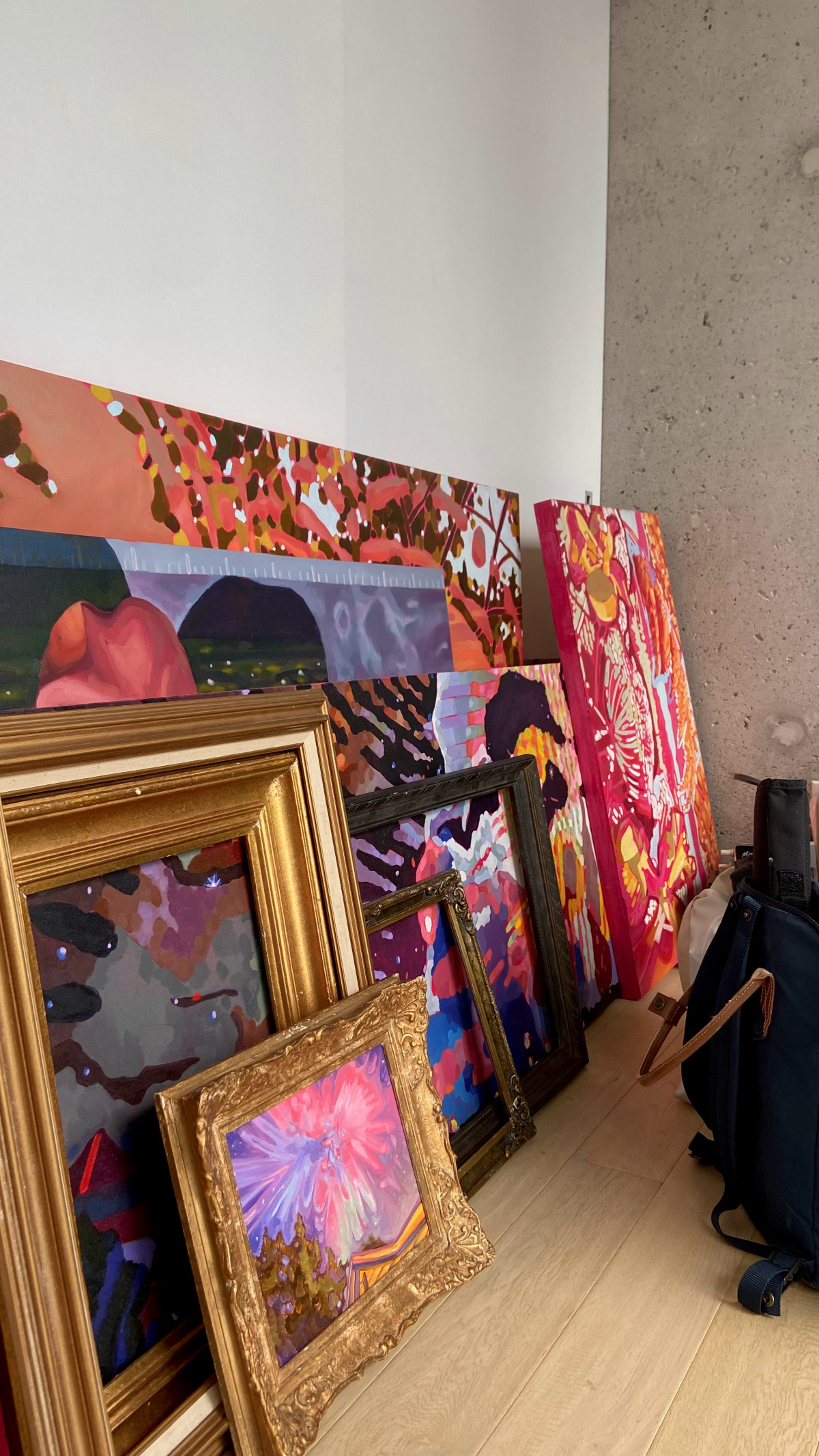 Kennedy's paintings all stacked up.