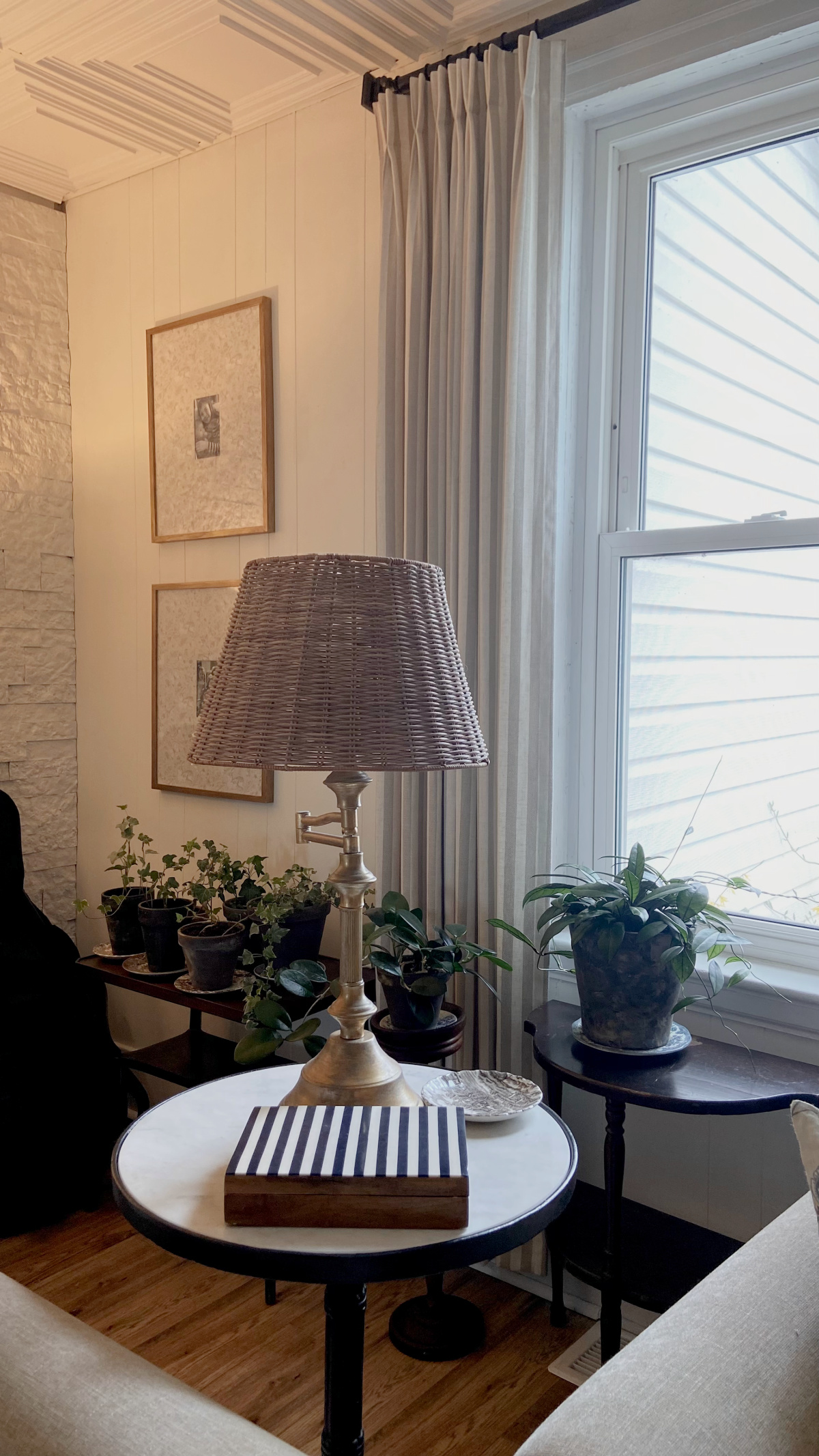 The frames with patterned photo mats hanging on a wall.