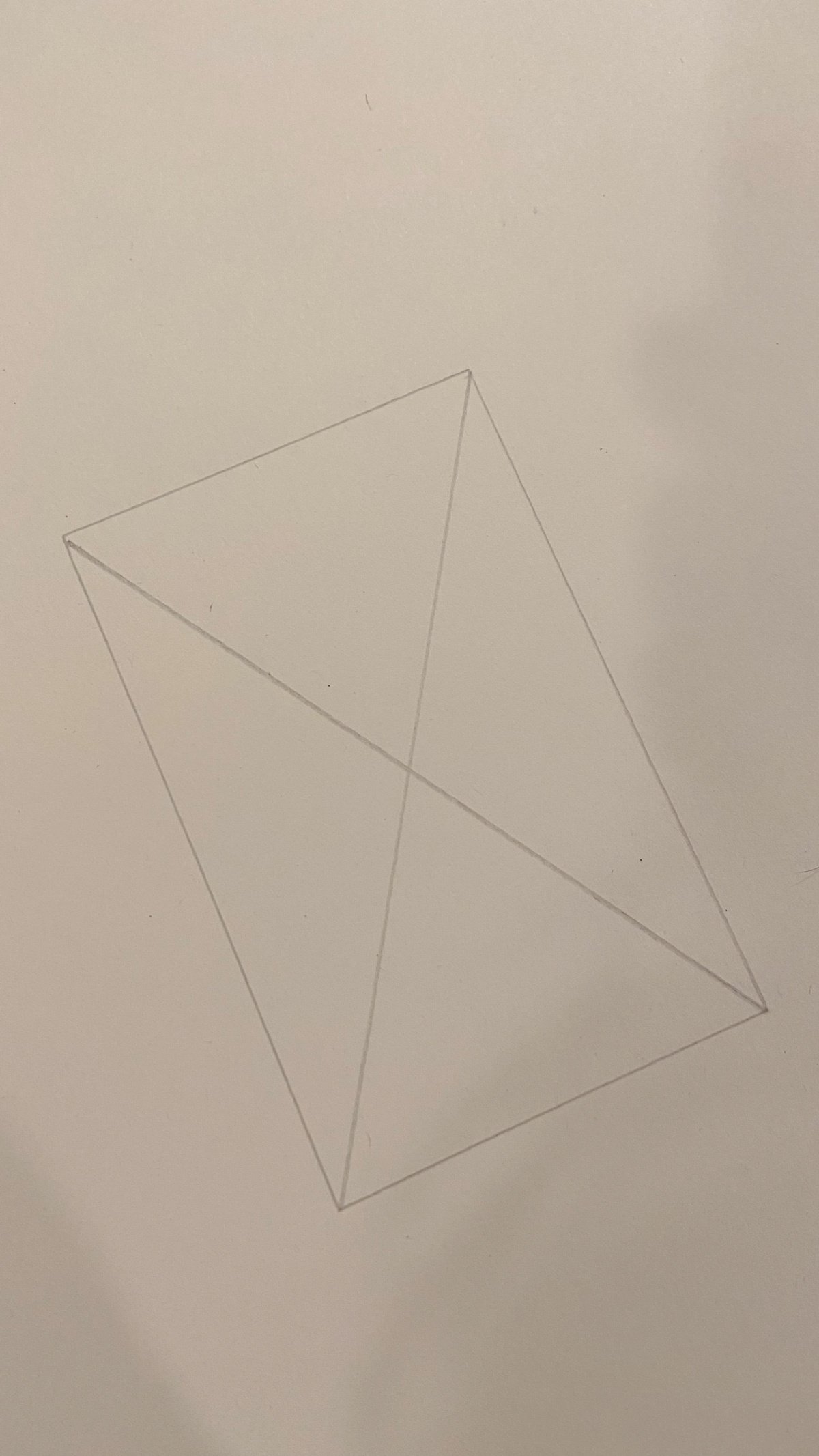 Tracing an x in the cutout for the photo mat.