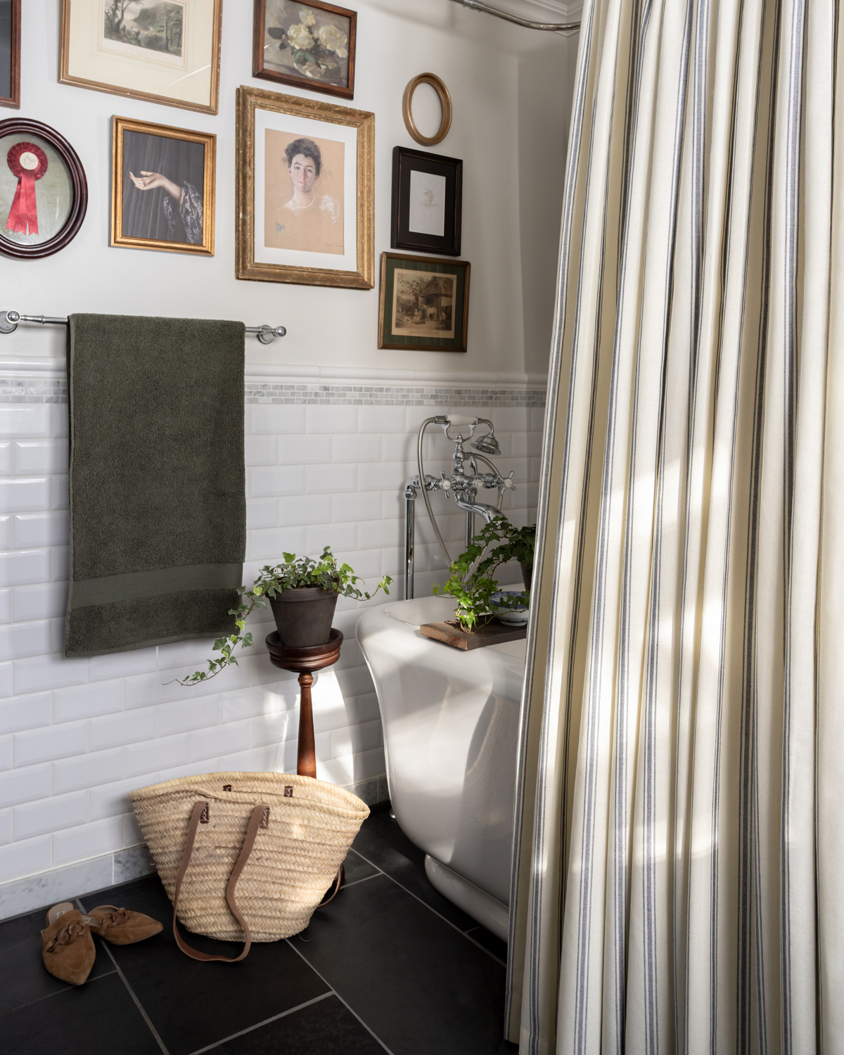 A gallery wall in a bathroom.