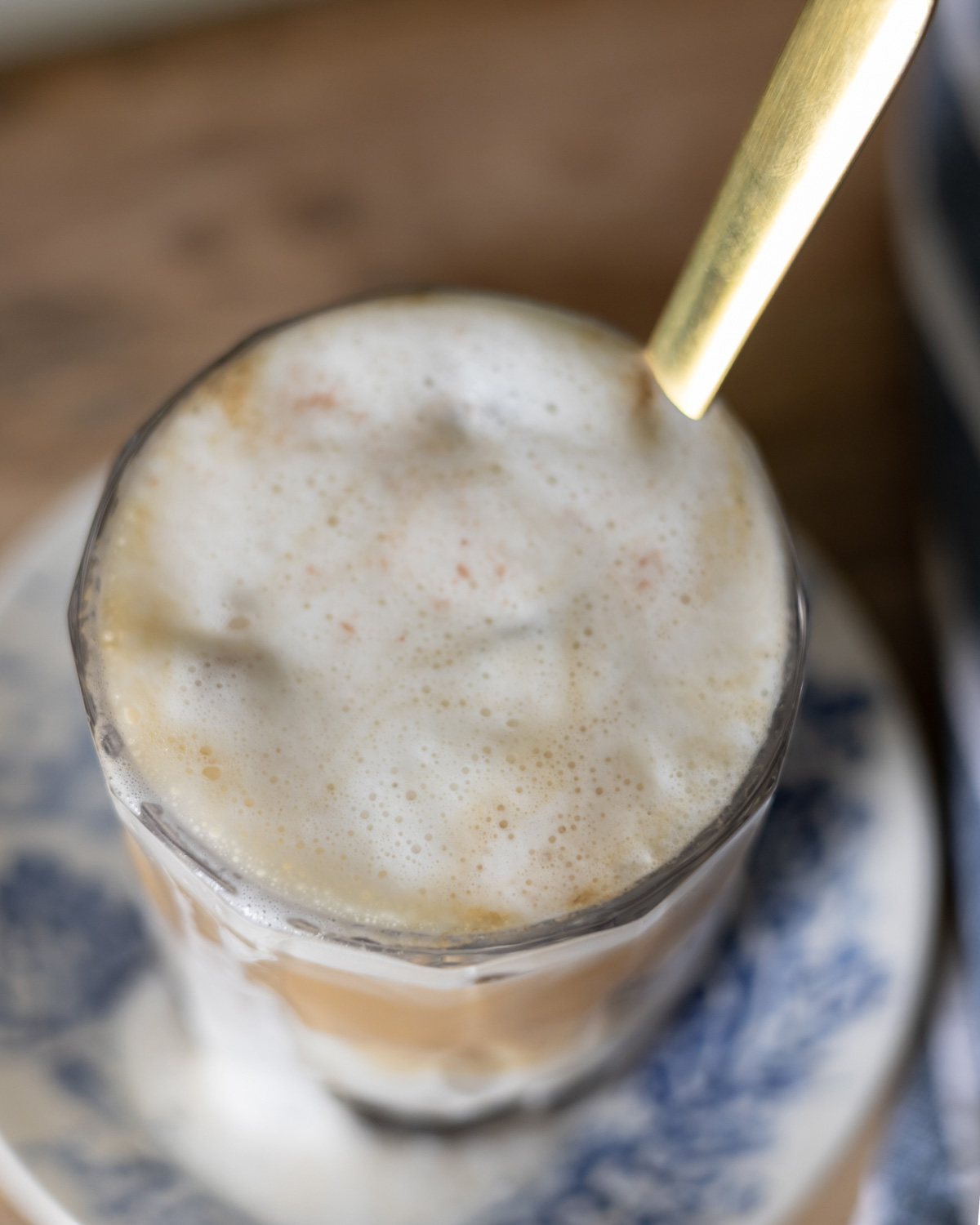 Creamy cold foam with a drizzle of maple syrup and a pink of pink Himalayan salt.