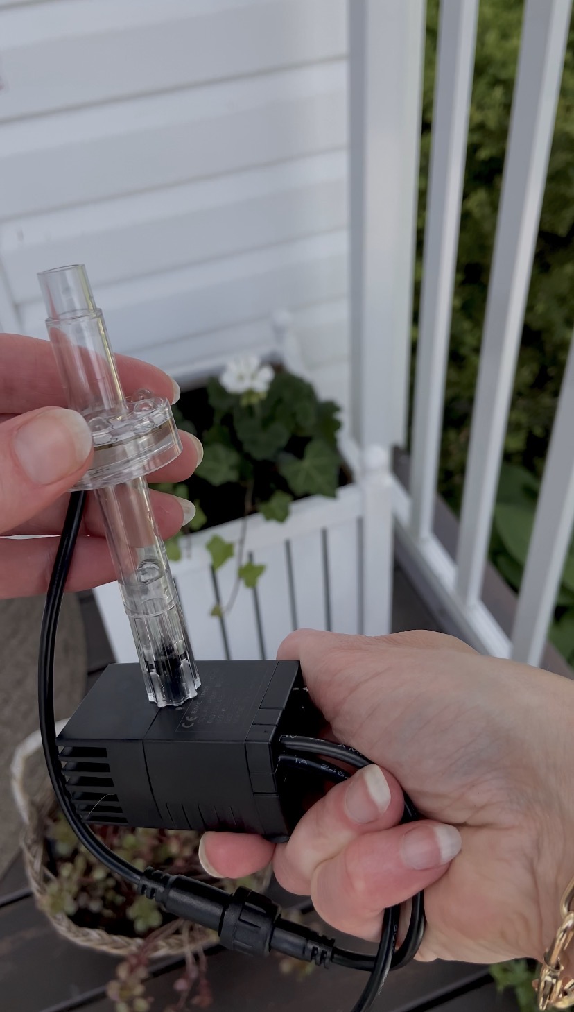 Putting together the fountain pump.