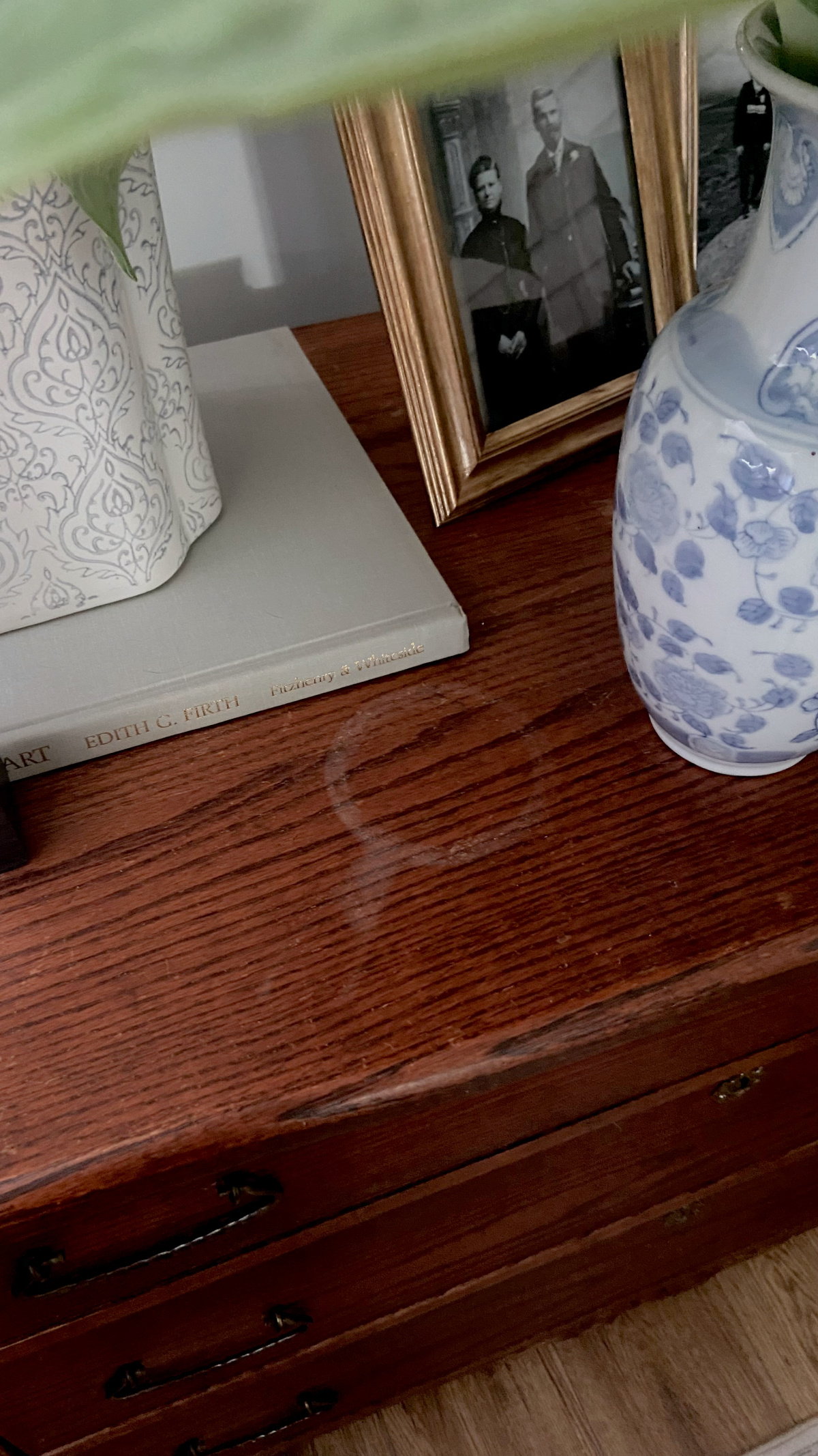 Water stain on an antique wood dresser.