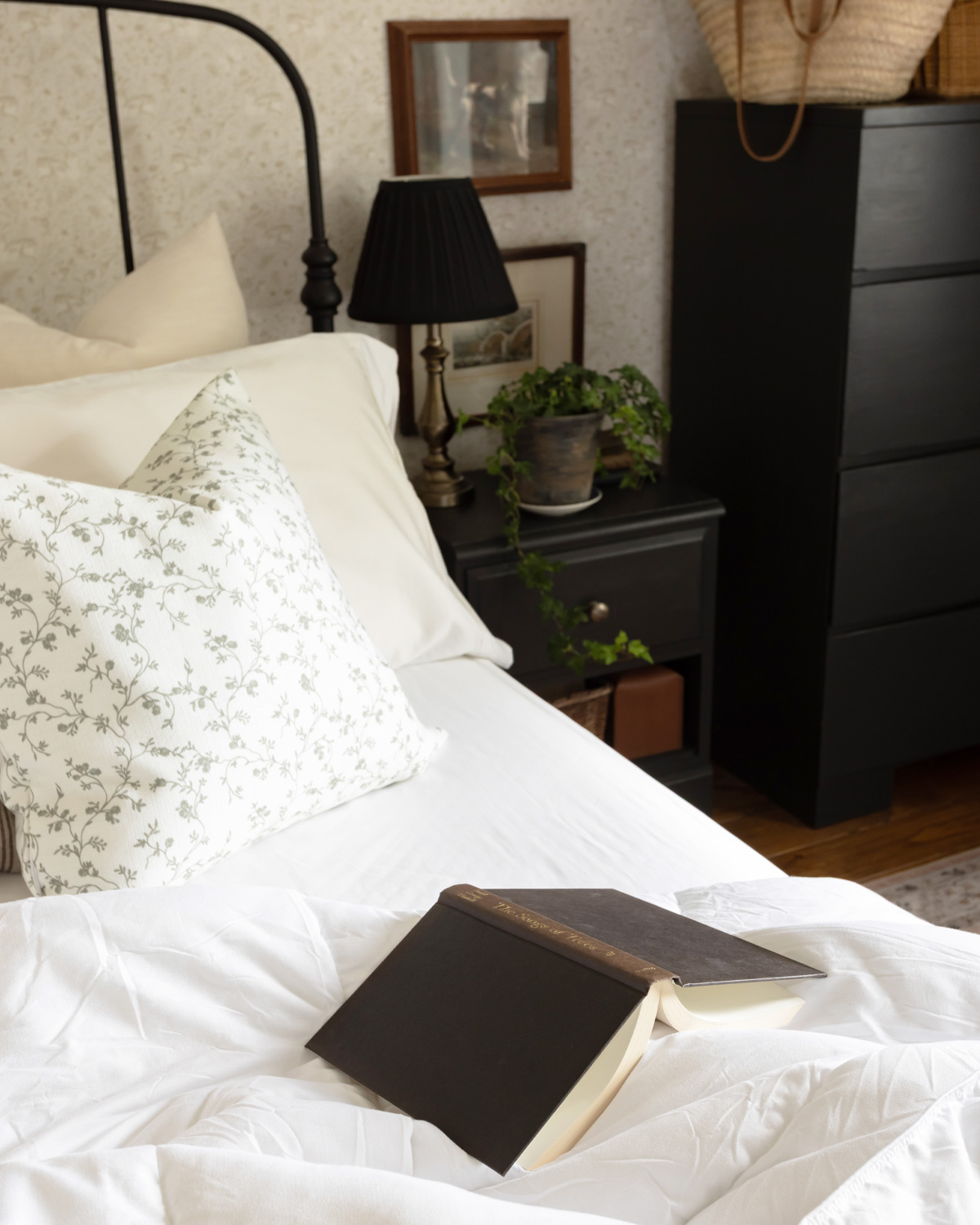 A cozy, welcoming bed with layers of imperfect bedding.